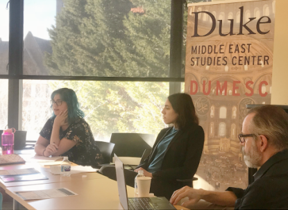 Graduate Students in discussion at conference at Duke